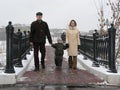 Family on winter bridge