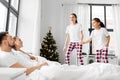 happy children wake their parents on christmas Royalty Free Stock Photo