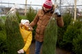 Happy family buying christmas tree at market Royalty Free Stock Photo