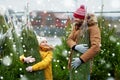 Happy family buying christmas tree at market Royalty Free Stock Photo