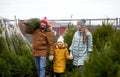 Happy family buying christmas tree at market Royalty Free Stock Photo