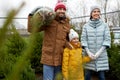 Happy family buying christmas tree at market Royalty Free Stock Photo