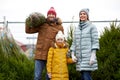 Happy family buying christmas tree at market Royalty Free Stock Photo