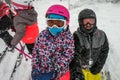 Family on winter vacations taking selfie on mountain slope