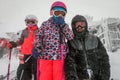 Family on winter vacations taking selfie on mountain slope