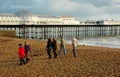 Family winter walk along the beach Royalty Free Stock Photo