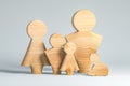 family wooden figures as unity social values Royalty Free Stock Photo