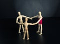 Family of wooden figures in circle Royalty Free Stock Photo