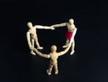 Family of wooden figures in circle Royalty Free Stock Photo