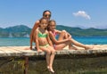 Family on the wooden pier on the sea Royalty Free Stock Photo