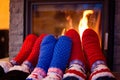 Family in woolen sock warming feet