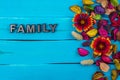 Family word on blue wood with flower Royalty Free Stock Photo