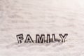 Family word on white sand Royalty Free Stock Photo