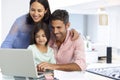 Family Working At Laptop With In Home Office Royalty Free Stock Photo