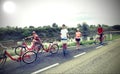 Family with young boys and little girl with bike on the road Royalty Free Stock Photo