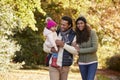 Family With Young Daughter Enjoying Autumn Countryside Walk Royalty Free Stock Photo