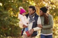 Family With Young Daughter Enjoying Autumn Countryside Walk Royalty Free Stock Photo