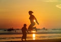 Famiy jumping at sunset Royalty Free Stock Photo