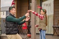 A famly decorating a new year tree