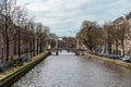 Famous Amsterdam canal and empty streets without people, Coronavirus Epidemic, city quarantine, COVID-19 outbreak Royalty Free Stock Photo