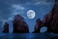 Famous arches of Los Cabos. Mexico. Baja California Sur. Rocky formations at moonlight background.