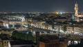 Famous Arnolfo tower of Palazzo Vecchio timelapse and Arno River at night in Florence, Tuscany, Italy Royalty Free Stock Photo