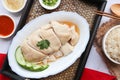 Hainanese Chicken rice - famous Singapore food top view served on the bamboo tray