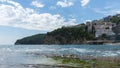 Famous beach resort. A view of the city of Budva and the Slovenska Plaza beach, Montenegro. Hotels in a cliff in the adriatic sea