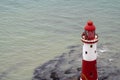 The famous Beachy Head lighthouse located on the rocky beach of Beachy Head the chalk headland cliff i Royalty Free Stock Photo