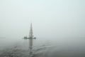 Famous and Beautiful Flooded Belltower on the River Volga on a rainy cloudy autumn day. Kalyazin, Russia