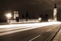 Famous and Beautiful night view to Big Ben and Houses of Parliament with Westminster bridge through night traffic, London, UK Royalty Free Stock Photo