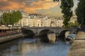 The famous and beautiful small bridge over the Seine River in Paris under the beautiful sunset sky, this is a beautiful bridge in