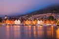 Bergen street at night with boats in Norway, UNESCO World Heritage Site Royalty Free Stock Photo