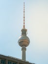 Famous Berlin Television Tower, observation Tower with office building in front, view from low angle during sunset, clear sky Royalty Free Stock Photo