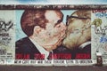 Famous Berlin Wall street art graffiti 'The Kiss' at East Side Gallery, Germany Royalty Free Stock Photo