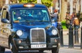 Famous black cab an a street in London