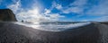 The famous Black Sand ocean Beach panorama. Mount Reynisfjall with Picturesque Basalt Columns and Dyrholaey Cape in far right. Vik Royalty Free Stock Photo