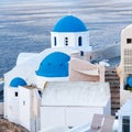 Blue Domed Church in Oia town and sea view on Santorini island, Cyclades, Greece Royalty Free Stock Photo