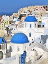 Beautiful blue domed and white buildings in Santorini, Greece Royalty Free Stock Photo