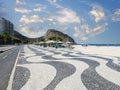 Famous Boardwalk on Copacabana Beach and coconut trees with blue sky in Rio de Janeiro Brazil