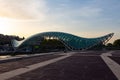 The famous Bridge of Peace in Tbilisi at sunset. Georgia country