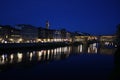 Famous bridge Ponte Vecchio with reflection in river Arno at night in Florence, Italy Royalty Free Stock Photo