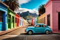 Famous bright color retro car parked by colorful houses in Bo Kaap district in Cape Town.