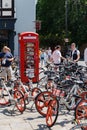 Famous british Red phone booth and many bicycles near Cambridge Punters Royalty Free Stock Photo