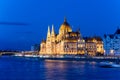 Famous Budapest parliament at the river Danube during blue hour Royalty Free Stock Photo