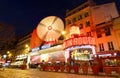 The famous cabaret Moulin Rouge decorated for Christmas 2021 at night , Paris, France. Royalty Free Stock Photo