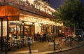 The famous Cafe Le Vrai Paris at night . It is located in the Montmartre, Paris, France.