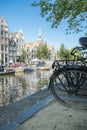 Famous canal of amsterdam with bicycles and boats