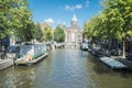 Famous canal of amsterdam with bicycles and boats