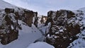 Famous canyon FjaÃÂ°rÃÂ¡rgljÃÂºfur in the south of Iceland with snow-covered rocks, steep cliffs and winding FjaÃÂ°rÃÂ¡ river.